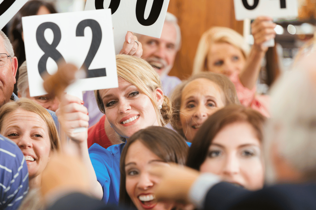 People Bidding At the Auction